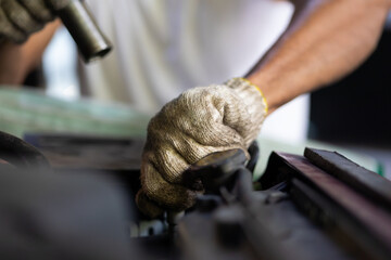 Closeup hand and spanner. Engineer mechanic male repairs and service car in garage. Car maintenance and auto service garage concept.