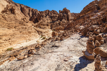 White Canyon in Sinai. Yellow and orange sandstone textured carved mountain, bright blue sky. Egyptian desert landscape. Sinai peninsula, Egypt