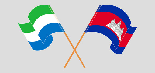 Crossed and waving flags of Sierra Leone and Cambodia