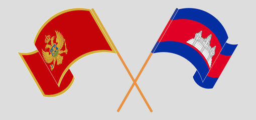 Crossed and waving flags of Montenegro and Cambodia
