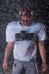 American Football Field: Lonely Athlete Warrior Standing on a Field Holds his Helmet and Ready to...