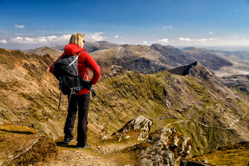 Travel tourism Wales young female hiker on holiday