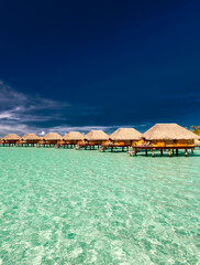 Bora Bora Overwater Bungalows in tropical sunlight Polynesia