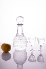 decanter with glasses of vodka on a white background alcohol shot