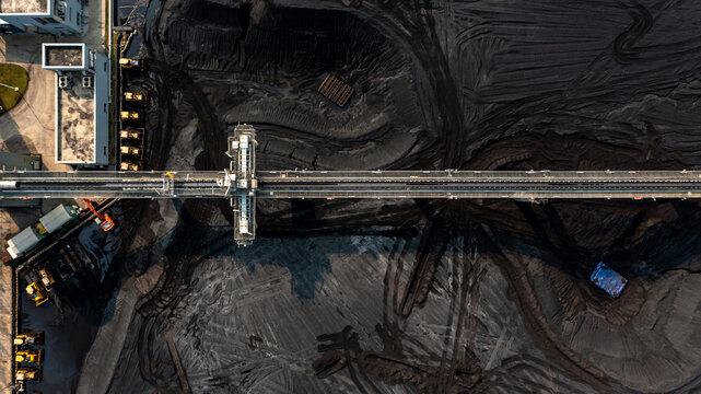 Aerial Top View Moving Belt With Heap Of Coal Next To The Coal Power Plant, Coal Mining View From Above,