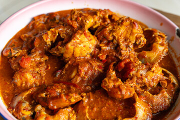Baby Crab sauce padang (Indonesian Kepiting Saus Padang). dish of crab served in hot and spicy Padang sauce. 