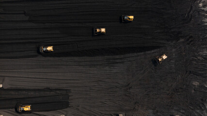 Aerial top view moving belt with heap of coal next to the coal power plant, Coal mining view from above, © Darunrat