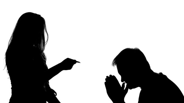 silhouette of couple arguing