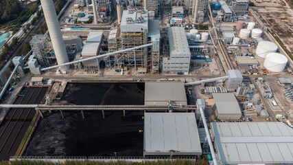Aerial top view moving belt with heap of coal next to the coal power plant, Coal mining view from above,