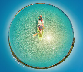 Tiny planet 360 view of kayak from Piantarella beach. Aerial view of Piana island in Corsica of...