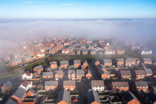 Aerial view of city under the fog in England