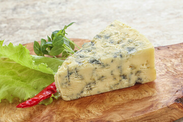 Blue cheese piece over board