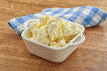 Italian soft mascarpone cheese in the bowl