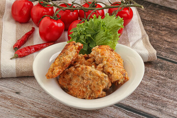 Fried salmonn cutlet in the bowl