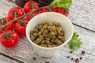 Marinated green capers in the bowl
