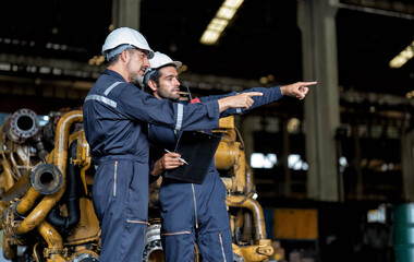 In heavy industry maintenance manager meet engineer checking and agreement hand check and sign on...