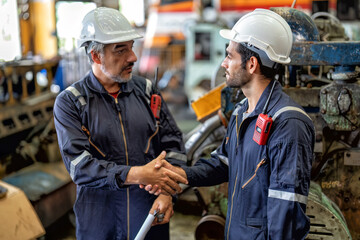 In heavy industry maintenance manager meet engineer checking and agreement hand check and sign on...