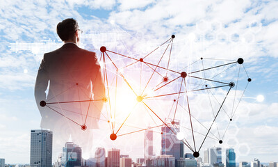 Concept of business success and control with confident boss against cityscape background