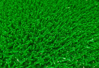 A close-up of artificial grass with selective focus