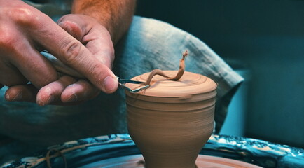 Creating a Vase or Pot. Making Clay jug. Sculptor in Apron Workshop making a Jug close-up. Potter's Wheel. Pottery Concept.