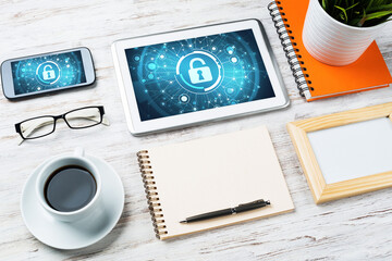 Web security and technology concept with tablet pc on wooden table