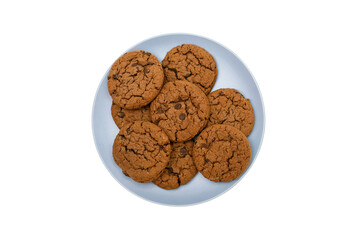Chocolate chip cookies lie on a plate on a white background in the center of the image. Sweet homemade chocolate chip cookies. American style quick breakfast chocolate chip cookie
