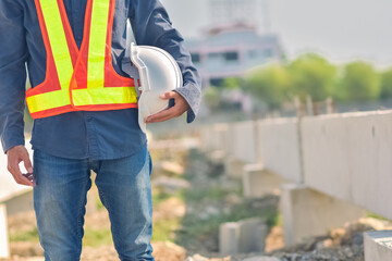 Engineer holding hard hat construction worker professional safety work industry building person manager service