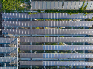 solar or photovoltaic cell in panel on roof top building,Technology to generate electrical power, direct current electricity by light. Green clean energy for future.