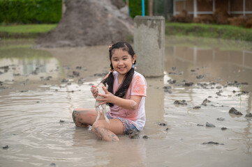 Asian children girl in farm frog