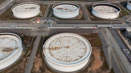 Aerial view crude oil storage tank, White storage tank farm chemical petroleum petrochemical refinery product, oil and gas fuel storage crude energy silos terminal.