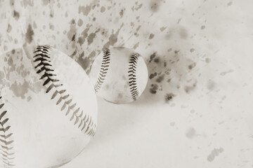 Baseballs in double exposure with vintage monochrome background for sport.