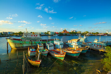 fishing boats and city scenery,Fishing boats and beautiful sky,Many boats moored in sunrise morning...