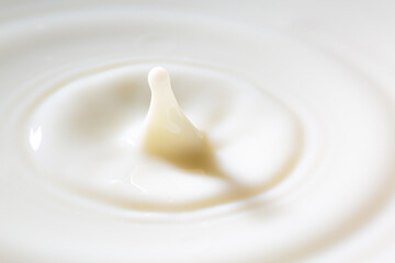 macro milk drop,milk drops with ripples,Breast milk for falling in the milk of a berry or a piece of fruit.