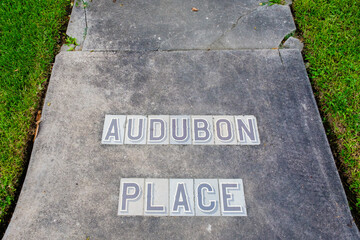 Traditional Audubon Place Tile Inlay Street Sign on Sidewalk in Uptown Neighborhood in New Orleans,...