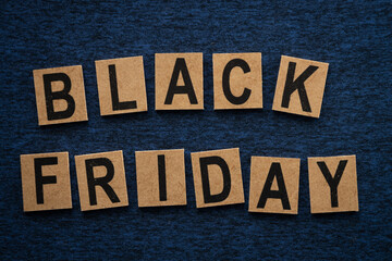 Sign with the words black friday on a blue cloth symbolizing discounts on friday