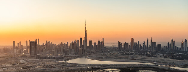 Aerial Panorama sunset Dubai city modern skyscrapers UAE