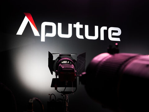 AMSTERDAM - SEP 09, 2022: Aputure exhibition stand on IBC with Logo light as a thematic background