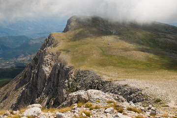 Panoramic view of misty mountain with fog in the summer season