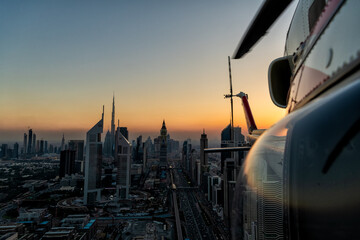 Aerial Dubai sunset helicopter flying Sheikh Zayed Road