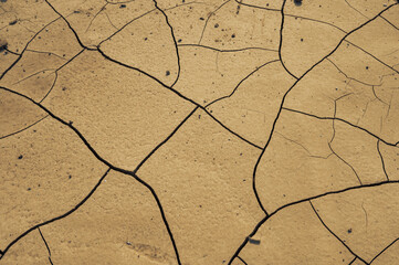 The ground with cracks for the background. Concept of crisis environment.