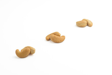 Cashew nuts isolated on white background. High key photography.