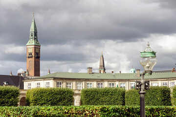 Fototapeta premium City towers in central Copenhagen against the rainy cloudy sky.