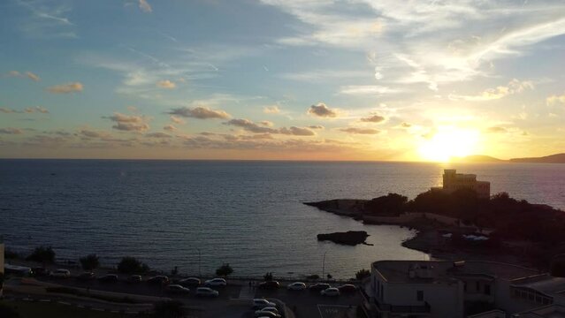 Drone view at sunset from las tronas with capocaccia in background in the Alghero coast in Sardinia, Italy
