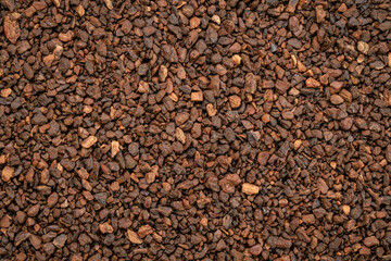 Macro background and texture of chicory granules often used with or as a substitute for coffee,...