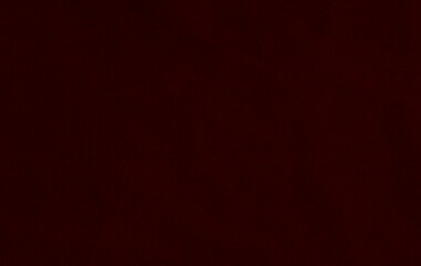 Dark red old  velvet fabric texture used as background. Red gradient fabric background of soft and smooth textile material. There is space for text..