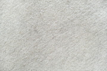 The texture of white felt. Silver felt background. Felt like snow.
