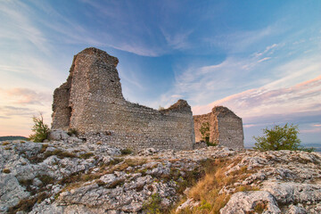 Obraz premium A ruin of castle Sirotci hradek in Moravia region, sunset light.