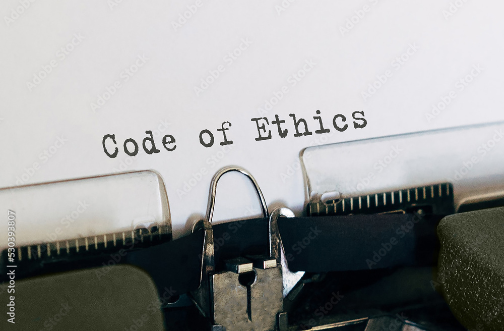 Poster text code of ethics typed on retro typewriter