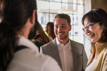 Businessmen discussing company policy standing indoors