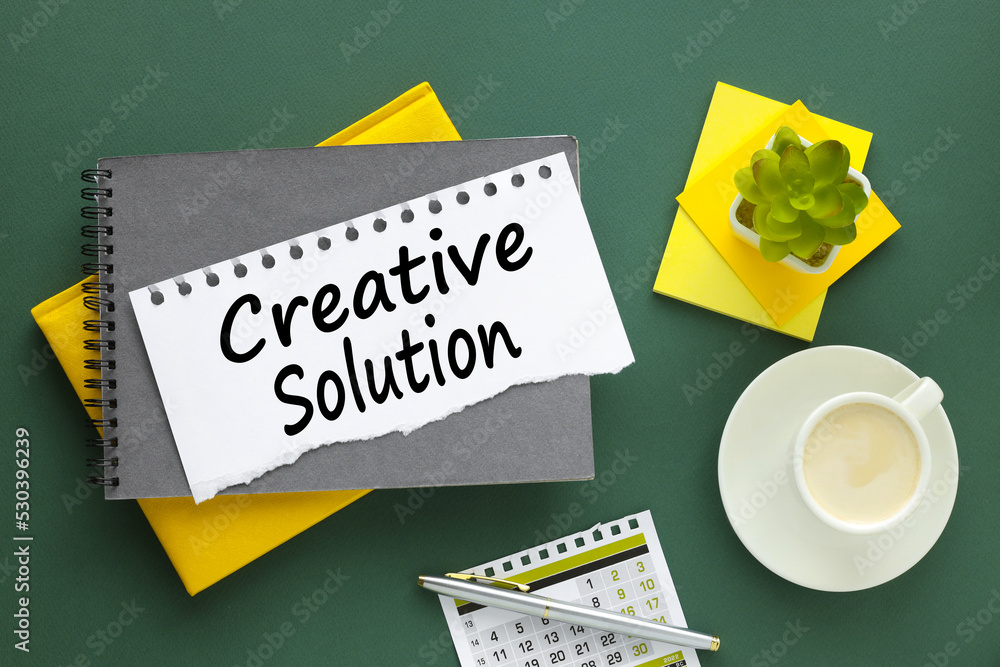 Poster creative solution. white torn paper with text on gray notebook